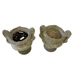 Pair two-piece cast stone garden planters, in the form of handled urns on circular footed bases