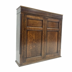 19th century oak cupboard, mahogany banded frieze with string inlay over two panelled doors revealing three fixed shelves, flanked by fluted pilasters, W118cm