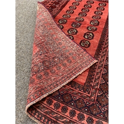 Persian design red ground rug, repeating gul motif on red field enclosed by multi line border,100cm x 160cm