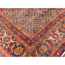  Persian Bijar ground carpet, lozenge medallion on red field surrounded by all over stylised floral motifs, double guarded border, 390cm  x 295cm  