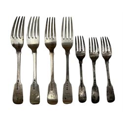 Three George IV silver fiddle pattern table forks engraved with a crest London 1824 Maker Richard Pouldon, another fork London 1835 and three dessert forks London 1830 (7)