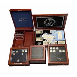 Various incomplete coin collections each housed in a display box or case including three United States of America banknotes from 'The Complete Set of World War II Emergency Currency', various fifty pence pieces from 'The World of Beatrix Potter 50 pence Collection' etc