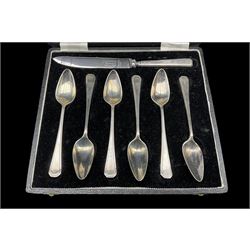 Cased set of six silver grapefruit spoons and silver handled knife Sheffield 1958 Maker Travis Wilson & Co. and eleven Roman design coffee spoons London 1976 Maker Francis Howard 7.5oz weighable silver 