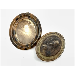 18th century oval horn box attributed to John Obrisset, the cover moulded with a portrait in profile of King Charles I in armour L10cm and a 19th century oval Tortoiseshell pique work frame with later portrait (2)