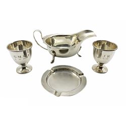 Silver sauce boat with crimped rim and loop handle Sheffield 1934 Maker Sydney Hall & Co, pair of silver egg cups and a silver ash tray 6.5oz