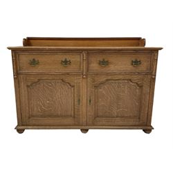 Late 19th century oak sideboard, the raised back over two drawers and two cupboards, opening to reveal two fixed shelves, raised on turned bun feet 