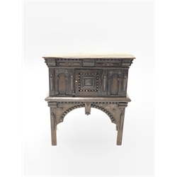 18th century style oak cupboard, with geometric carved door over an architectural arched apron and square supports 