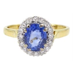 18ct gold oval light blue Ceylon sapphire and round brilliant cut diamond cluster ring, London 1995, sapphire approx 1.60 carat