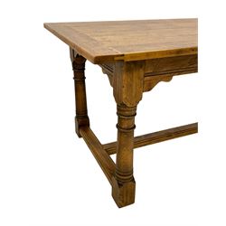 17th century design oak refectory dining table, rectangular plank top over frieze rail, raised on turned supports