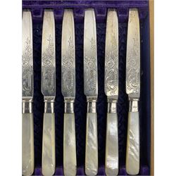 Set of twelve Edwardian dessert knives and forks with engraved silver blades and mother of pearl handles, cased Sheffield 1902 Maker Watson & Gillott