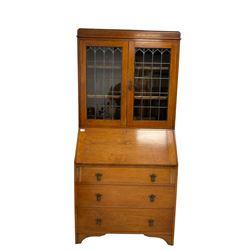 Edwardian walnut bureau bookcase, lead glazed doors over fall front with fitted interior over three drawers, raised on bracket supports 
