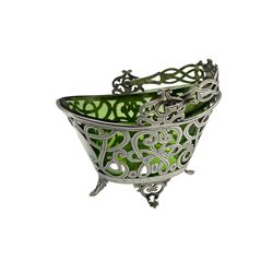 Edward VII silver boat shape sugar basket with pierced and scroll decoration, vacant cartouches and swing handle with green glass liner L11cm Birmingham 1901 Maker Levi & Salaman
