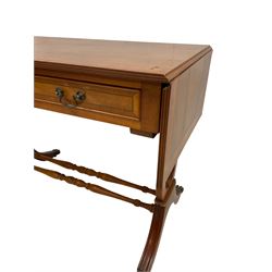 Pair yew wood drop leaf stretcher side or sofa tables, fitted with two drawers, on lyre shaped ends with splayed moulded supports joined by turned stretchers, hairy paw castors