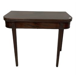 Mahogany fold over tea table, raised on reeded and squared supports 