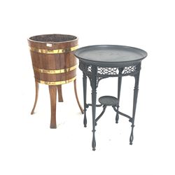 Oak and brass bound barrel shaped planter raised on four splayed supports, stamped 'Tubs for shrubs' under (H77cm) together with a black painted occasional table with tray top and fret work detail (D53cm