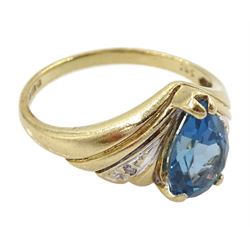 9ct gold pear cut London blue topaz ring, with diamond chip shoulders, hallmarked 
