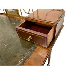 Edwardian inlaid mahogany writing table or desk, shaped top with pierced brass gallery back and central photograph with two trinket drawers, inset leather writing surface, fitted with central frieze drawer flanked by two short drawers, each with ebony and satinwood strung facias