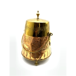 Early 20th century copper and brass coal scuttle and cover, of circular tapering form with swing handle and embossed with pastoral scene amongst scrolling foliage, H
