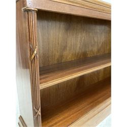 20th century mahogany book case, the rectangular and projecting top over one shelf, raised on a plinth base 