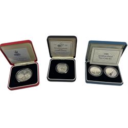 The Royal Mint United Kingdom 1989 silver proof two pound two coin set, 1995 silver proof piedfort two pounds and 1997 silver proof five pound coin, all cased with certificates