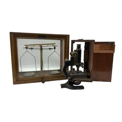 Early 20th century American microscope by Spencer, Buffalo, black japanned body and a set of Microid Senior balance scales in glazed case