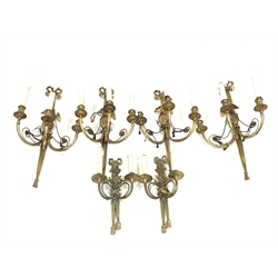 Set of four Regency design brass three branch wall lights with tied bow finials, oval back plates with eagle mounts and scroll branches H70cm and a pair of smaller similar two branch wall lights