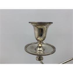 Set of four Edwardian silver candlesticks and pair of matching three light candelabra with tapering stems and reeded circular bases, one of the candalabra engraved with presentation inscription to 'Thomas Alexander Wallace, Town Clerk, Solicitor and Banker 1909' and engraved with a monogram, height of candlesticks 29cm, height of candelabra 42cm, hallmarked Hawksworth, Eyre & Co Ltd, Sheffield 1908/9 
