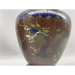 Pair of 20th century Chinese Cloisonne table lamps of baluster form, each decorated with a pair of Dragons chasing the flaming pearl amidst clouds, enclosed by floral and scroll borders, on hardwood bases with shades, H29cm