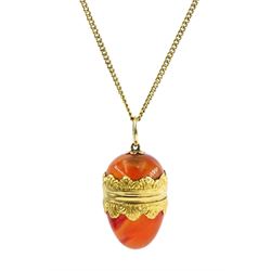 19th century 18ct gold mounted agate egg pendant, with hinged lid, on gold chain stamped 15c