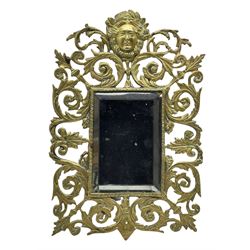 Victorian wall mirror with bevelled plate in a pierced brass frame with foliage and mask finial 39cm x 26cm overall