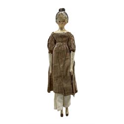 19th century wooden peg doll with painted hair face and shoes, wearing a cotton dress, L22.5cm 
