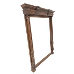 Large Edwardian mahogany framed overmantel mirror, water leaf, gadroon and chip carved cornice over two turned and fluted pilasters enclosing a bevelled mirror 
