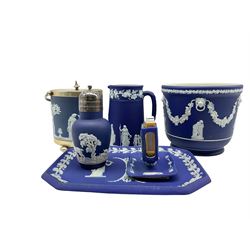 Group of late 19th/20th century Wedgwood dark blue jasper dip items comprising jardiniere D18cm, biscuit barrel with plated cover, match box holder, sugar caster, tray and jug (6)