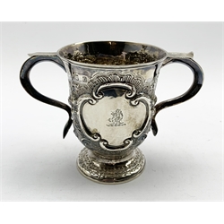 Late George II silver two handled cup engraved with a crest and with a later  embossed ploughing scene, flowers etc on a pedestal foot H12cm London 1758 Maker probably Benjamin Cartwright I 9.2oz
