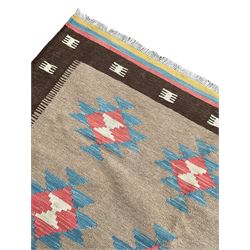 Kilim rug, light brown ground field decorated with geometric star motifs, dark brown border band and multi-coloured end bands