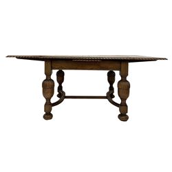 20th century extendable oak dining table, the extendable top with moulded edge, raised on turned supports 
