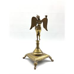 18th/19th Continental bronze candlestick in the form of a winged female figure on a square base and shaped supports H28cm
