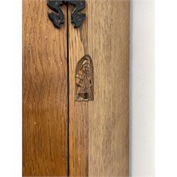 'Gnomeman' adzed oak corner cupboard, the top section enclosed by lead glazed door, the lower section enclosed by panelled door carved with mythical dragon, fitted with shelves, carved with gnome signature, by Thomas Whittaker of Little Beck, W70cm, H184cm, D45cm