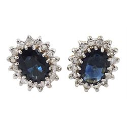 Pair of 9ct gold oval sapphire and diamond cluster stud earrings, hallmarked