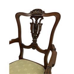 Late 19th century walnut elbow chair, shaped shell carved cresting rail over C-scroll carved and pierced splat, raised on cabriole supports; early to mid-20th century mahogany armchair, upholstered back and seat with swept arms and cabriole supports (2)