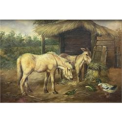 Follower of Edgar Hunt (British 1876-1953): Donkey and Horse in Farmyard, oil on panel indistinctly signed 13cm x 18cm