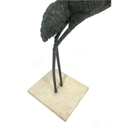 Bronzed metal life-size garden figure of a cane set into rectangular paving stone, 56cm x 50cm, H150cm