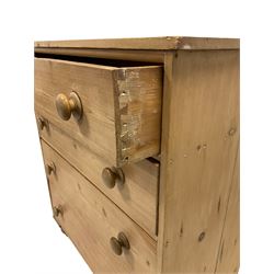 Victorian pine chest of drawers, the rectangular top over four long graduated drawers, raised on turned bun feet 