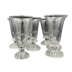 Matched set of seven Georgian jelly glasses, with plain trumpet bowls, petal edged foot and lemon squeezer bases, H11.5cm max (7)