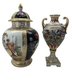 Continental porcelain vase and cover, decorated in the style of Augusts Rex, with alternating panels of courting couples and floral sprays on black ground, H24cm, together with a Capodimonte twin handled vase, decorated in relief with battle scenes (2)