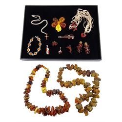 Collection of amber jewellery including silver violin, silver pendants and bracelet and two raw amber bead necklaces