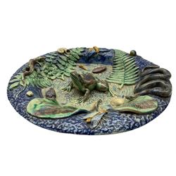 19th century French Palissy ware dish, a frog applied to the middle on a textured blue ground surrounded by shells, insects, snail, lizard, snake, fern leaf and other foliage, with bottled blue exterior, unmarked, D28cm