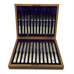 Set of twelve Edwardian dessert knives and forks with engraved silver blades and mother of pearl handles, cased Sheffield 1902 Maker Watson & Gillott
