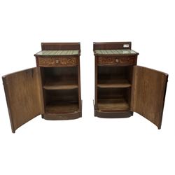 Pair of early 20th century inlaid mahogany bedside cabinets, raised back with curled reeded edge, fitted with single drawer with scrolling foliate inlays over single cupboard