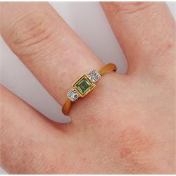 Early 20th century gold three stone milgrain set princess cut emerald and illusion set diamond ring, stamped 18ct Plat